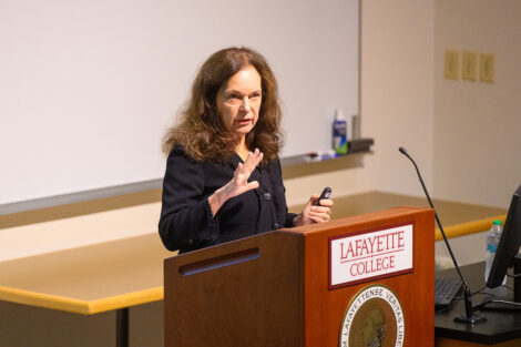 Olga Anna Duhl speaks at a podium.