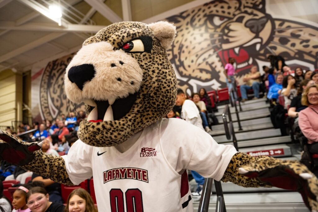 Roary the mascot moves through the crowd at Kirby Sports Center