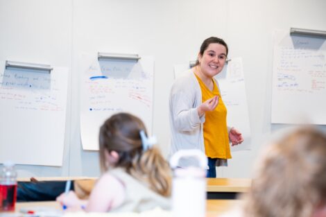 Sofia Serrano Assistant Professor Computer Science teaches in front of scouts at a whiteboard.
