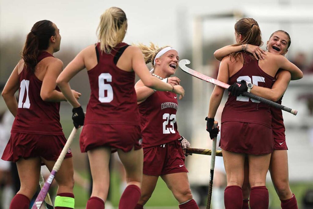 Members of the Lafayette field hocket team celebrating on the field